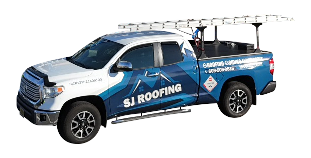 White and blue pickup truck with SJ Roofing signage on the side, equipped with a ladder rack holding an extended ladder.